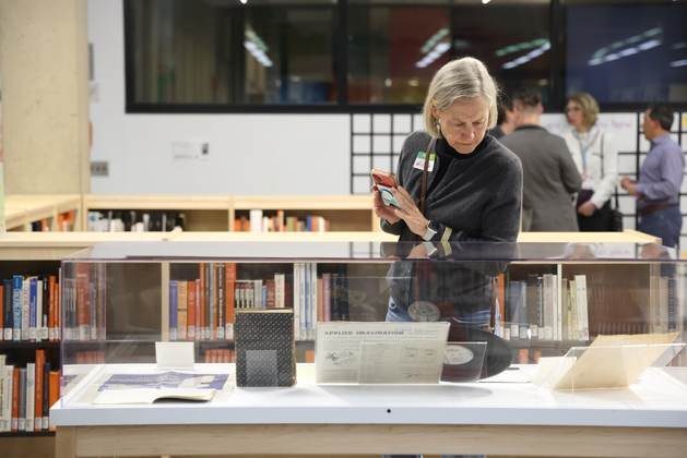 A visitor examining an artifact from the collection